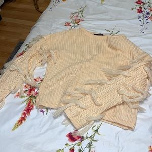 Peach sweater with fringe sleeves